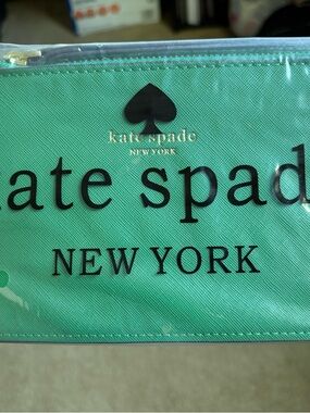 kate spade teal green clutch with black logo